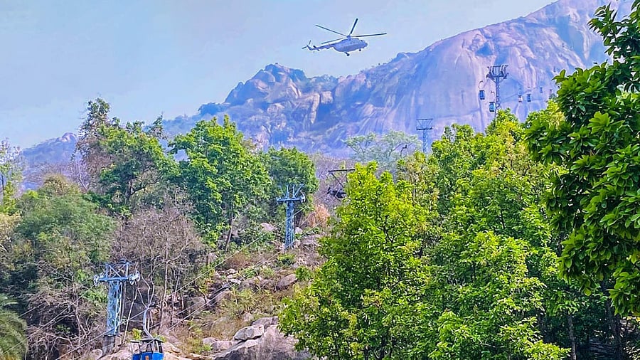 Rescue work under progress by Indian Air Force (IAF) and National Disaster Response Force (NDRF) at Trikut Hill after a collision of cable cars, in Deogar district. Credit: PTI Photo