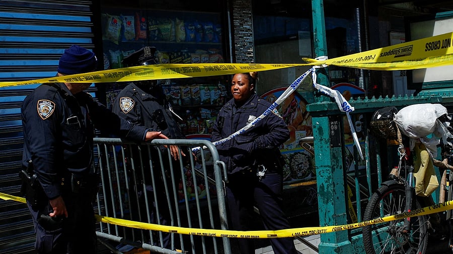 Law enforcement officers stand guard at the scene of a shooting at a subway station in the Brooklyn. Credit: Reuters Photo