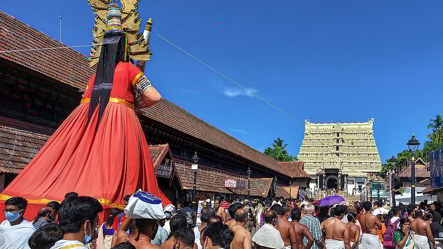 Devotees wait to offer prayers at Sree Padmanabhaswamy temple on the Vishu Day. Credit: PTI Photo