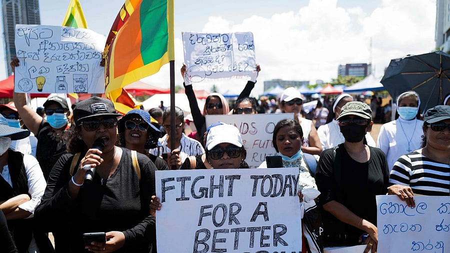 People shout slogans during an ongoing anti-government demonstration near the president's office in Colombo. Credit: AFP Photo
