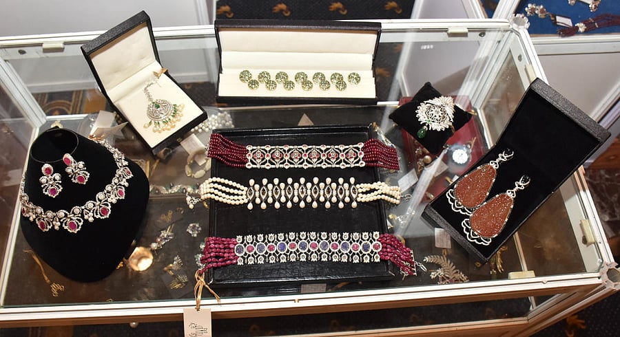Jewellery by Amrita Rana Singh (inset) from Nepal, is finely crafted using diamonds, cabochon rubies, faceted emeralds, rare sapphires and precious pearls and retains a classic vintage look. Credit: DH Photo