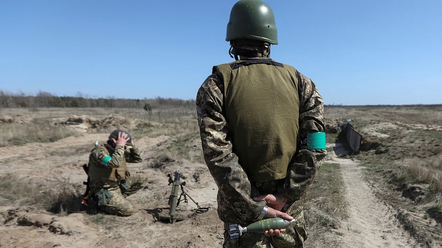 Members of the Ukrainian Territorial Defence Forces attend military drills, as Russia’s attack on Ukraine continues, in Kyiv Region. Credit: Reuters Photo