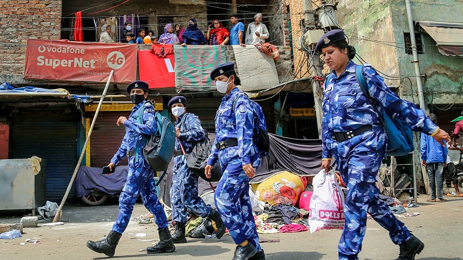 Rapid Action Force personnel keep vigil after clashes broke out between two communities during a Hanuman Jayanti procession on Saturday, at Jahangirpuri in New Delhi. Credit: PTI File Photo