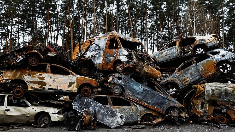 Cars destroyed amid Russia's attack on Ukraine are seen in Irpin. Credit: Reuters Photo