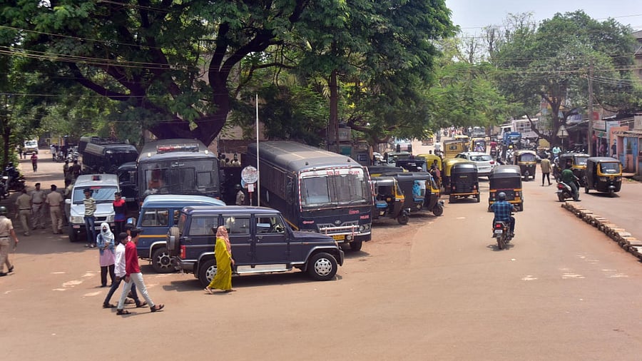 Police vehicles parked at Indi Pump Circle in Old Hubballi on Monday. Credit: DH Photo
