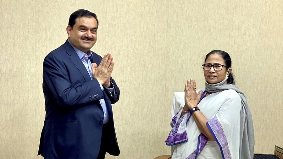 West Bengal Chief Minister Mamata Banerjee (L) with Adani Group Chairman Gautam Adani. Credit: PTI File Photo