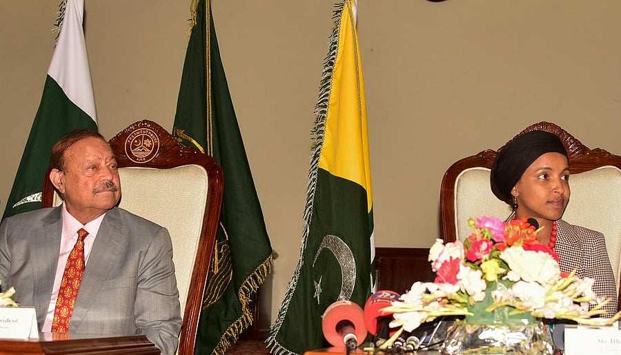 US congresswoman Ilhan Omar (R) and President's of Pakistan-administered Kashmir Sultan Mehmood Chaudhry (L) attend a press conference in Muzaffarabad on April 21, 2022. (Photo by Sajjad QAYYUM / AFP)