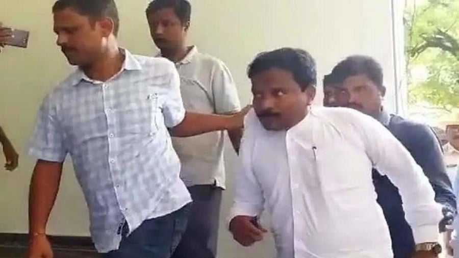 CID sleuths bring Afzalpur Block Congress president Mahantesh Patil for enquiry in Kalaburagi on Friday. Credit: DH Photo