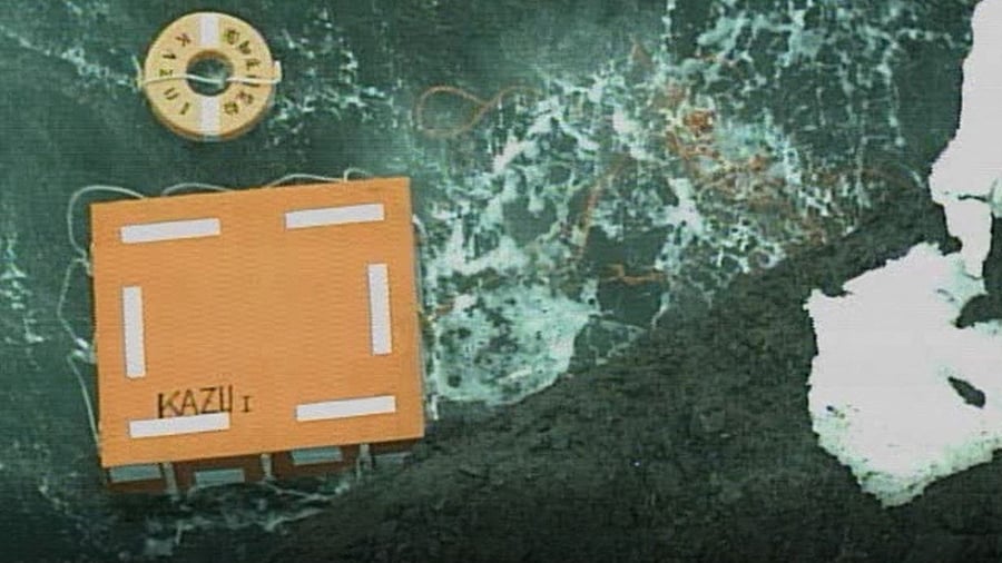 Images released by the coast guard showed rescuers crouched in a crevasse along the rocky shoreline inspecting an area, as well as items clearly marked Kazu I washed up on a beach, with ice still visible on the shore. Credit: Reuters Photo