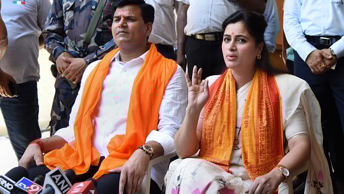 Amravati MP Navneet Kaur Rana with husband MLA Ravi Rana. Credit: PTI Photo
