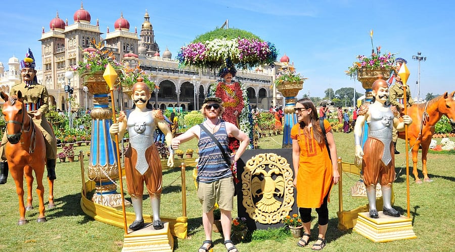 Foreigners visit during the inauguration of Flower Show at Amba Vilas Palace in Mysuru on Thursday. Credit: DH Photo/ Prashanth HG