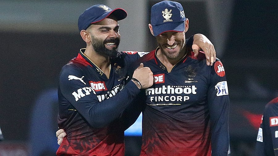 Virat Kohli with Faf du Plessis. Credit: PTI File Photo