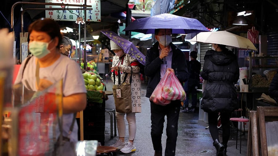 People shop at a market in Taipei. Credit: Reuters Photo