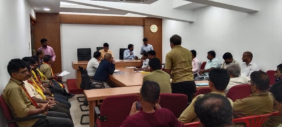 Mayor Premananda Shetty chairs a meeting in Mangaluru.