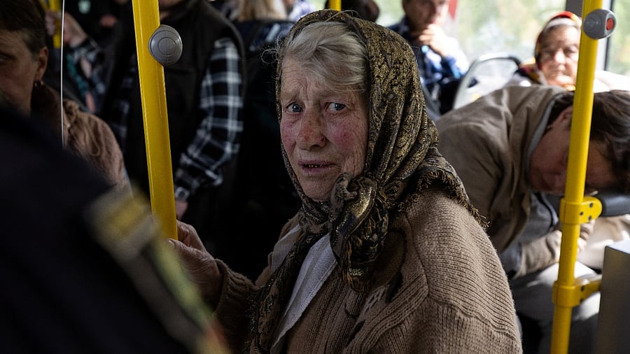 A Ukrainian woman sits on a bus after being evacuated from the frontline city of Lyman, amid Russia's invasion of Ukraine, in Slovyansk, Donetsk region. Credit: Reuters Photo