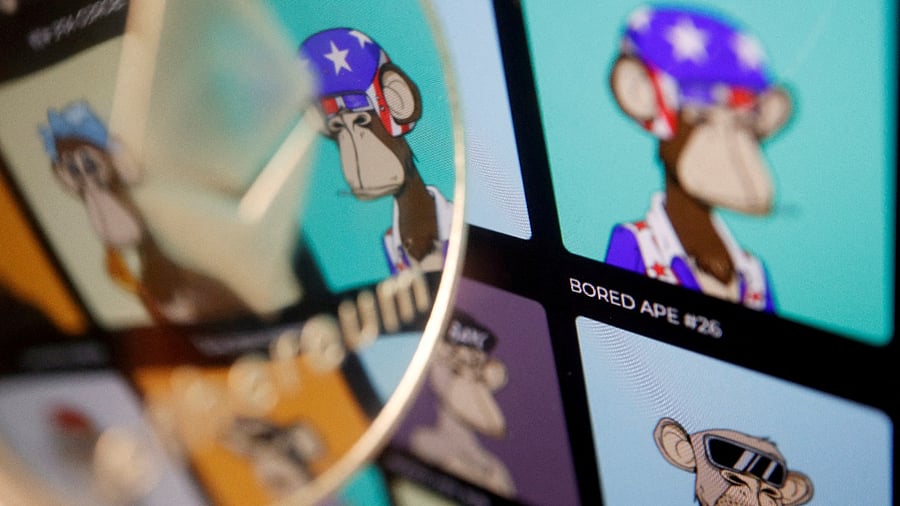 A representation of cryptocurrency Ethereum is seen next to non-fungible tokens (NFTs) of Yuga Labs "Bored Ape Yacht Club" collection displayed on its website. credit: Reuters Photo