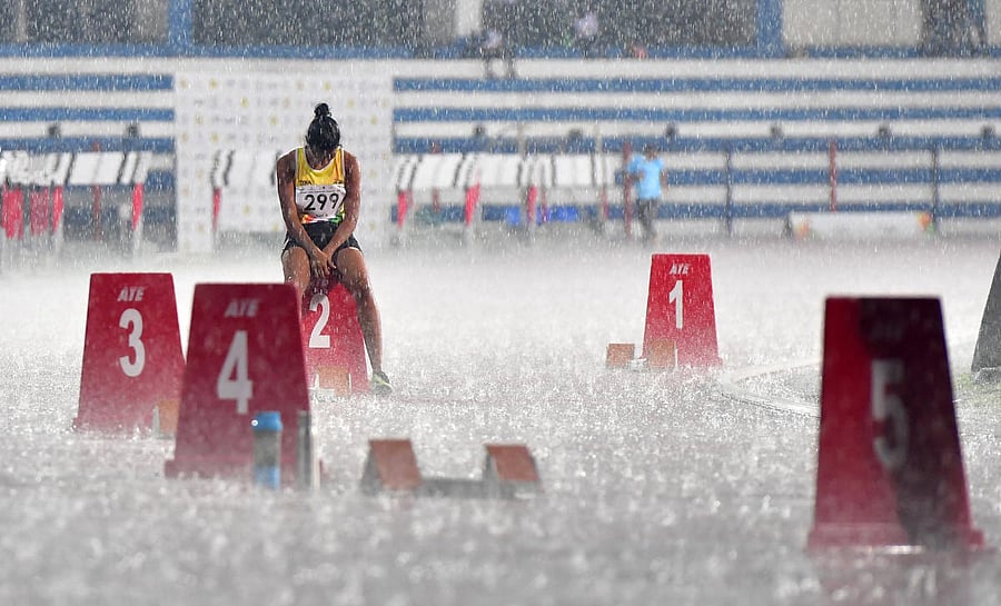 Rain stopped these athletes in their tracks during the Khelo India University Games at the Sree Kanteerava Stadium on Sunday. Credit: DH PHoto/Krishnakumar P S