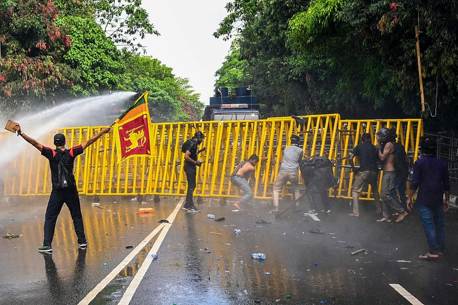 Earlier Friday, police used tear gas and water cannon to disperse students attempting to storm the national parliament demanding Rajapaksa resign. Credit: AFP Photo