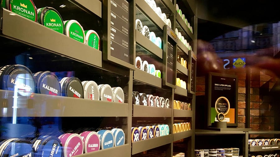 Moist powder tobacco "snus" cans are seen on shelves at a Swedish Match store in Stockholm, Sweden October 24, 2018. Picture taken October 24, 2018. Credit: Reuters Photo