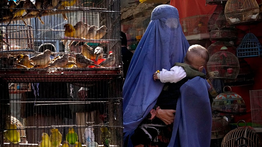 Women across the country have been banned from travelling alone, and last week the authorities ordered them to cover up completely in public, ideally with a burqa. Credit: AP Photo