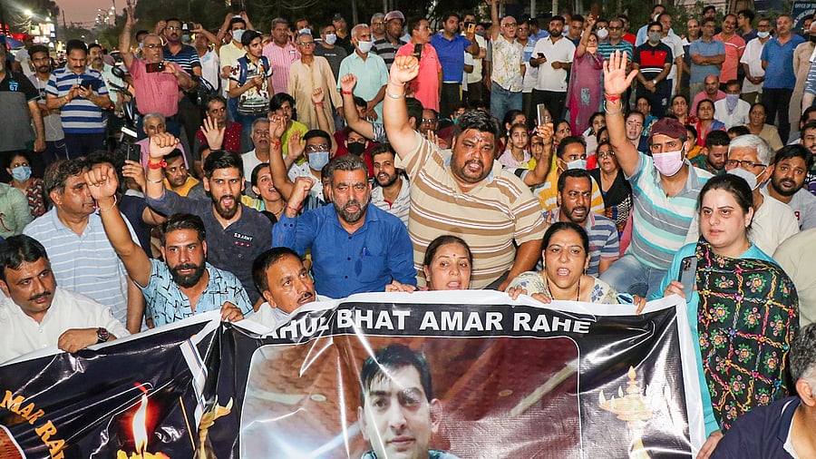 Kashmiri Pandits raise slogans during a protest against the Pakistan over the killing of Rahul Bhat, in Jammu. Credit: PTI Photo