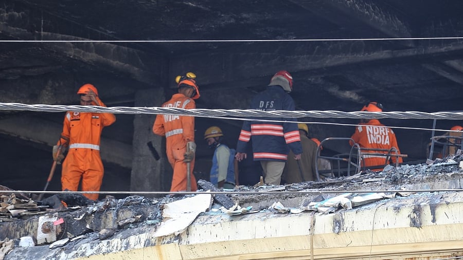 NDRF team at the site of a fire in a four-storey commercial building at Mundka area in New Delhi. Credit: IANS Photo