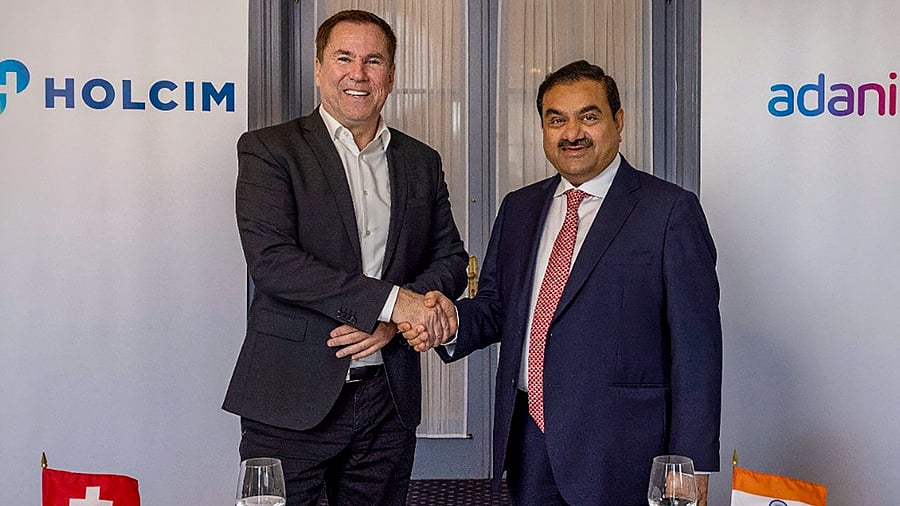 Adani Group Chairman Gautam Adani with Holcim CEO Jan Jenisch. Credit: Twitter/@gautam_adani