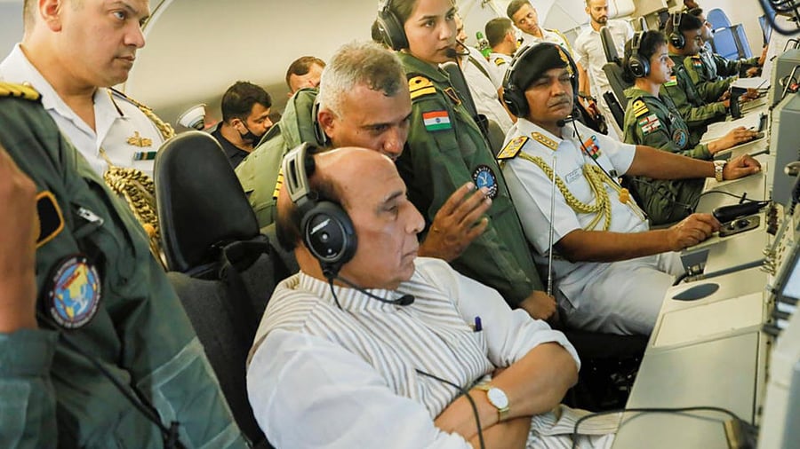 Defence Minister Rajnath Singh rides P8I Long Range Maritime Reconnaissance Anti-Submarine Warfare aircraft of the Indian Navy, during his visit to Mumbai. Chief of the Naval Staff Admiral R. Hari Kumar is also seen. Credit: PTI Photo