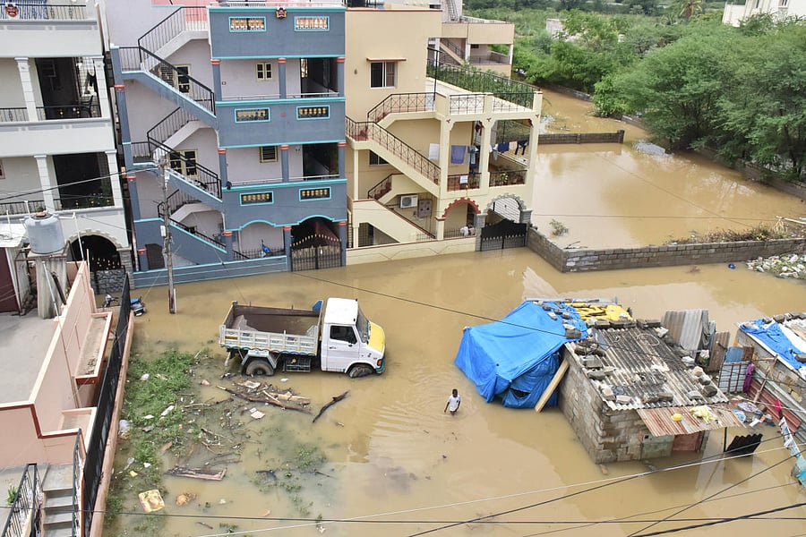An aerial view of a submerged Sai Layout at Horamavu Agara on Wednesday. Credit: DH Photo/B K Janardhan