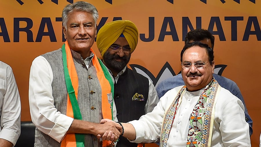 Former Punjab Congress President Sunil Jakhar being greeted by BJP President J P Nadda. Credit: PTI Photo