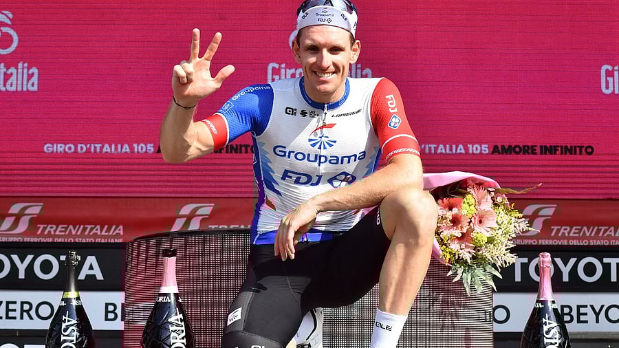 FDJ's Arnaud Demare celebrates after winning stage 13 on the podium. Credit: Reuters Photo