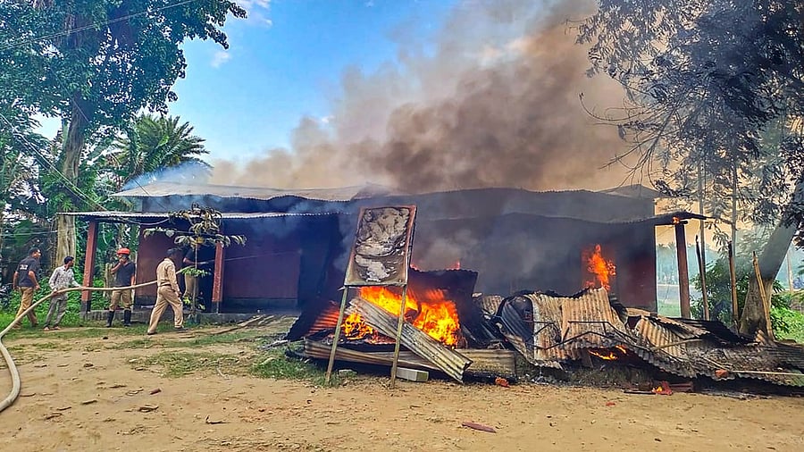The Batadrava police station after some miscreants set it on fire following the alleged death of a person in police custody, in Nagaon. Credit: PTI Photo