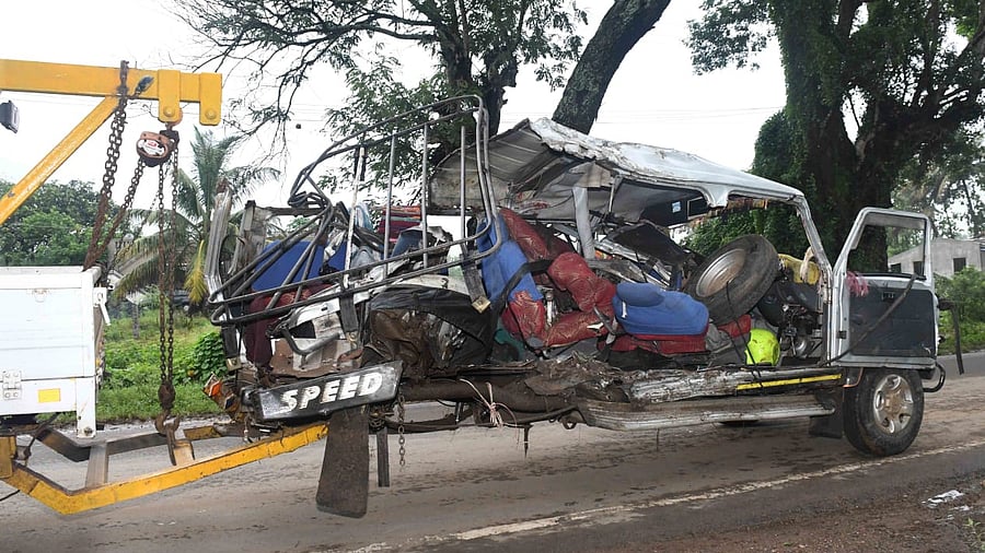 Mangled remains of tempo trax which rammed into a tree at Baad Cross off Dharwad killing seven persons. Credit: DH Photo