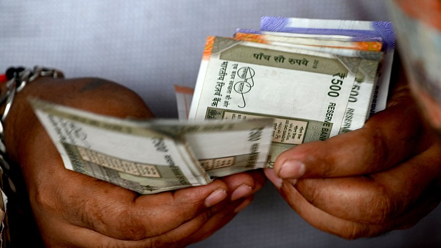During the trading session, the rupee touched an intra-day low of 77.67 and a high of 77.51. Credit: AFP Photo