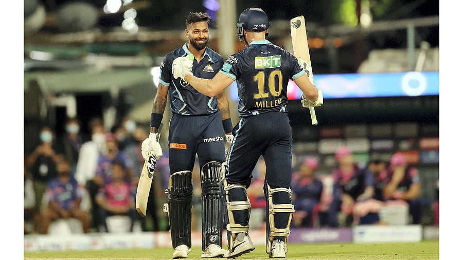 David Miller and Hardik Pandya of Gujarat Titans celebrate after winning their Indian Premier League 2022 Qualifier 1 cricket match against Rajasthan Royals, at Eden Gardens in Kolkata. Credit: PTI Photo