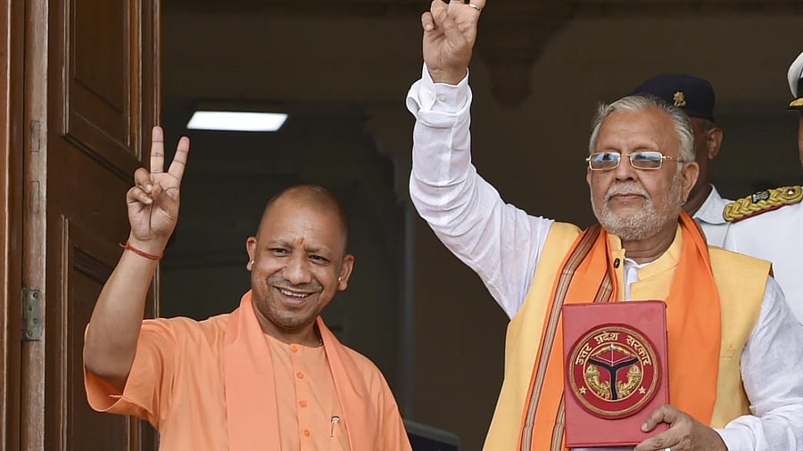 Uttar Pradesh Chief Minister Yogi Adityanath with state Finance Minister Suresh Kumar Khanna before the presentation of the State Budget 2022-23. Credit: PTI Photo