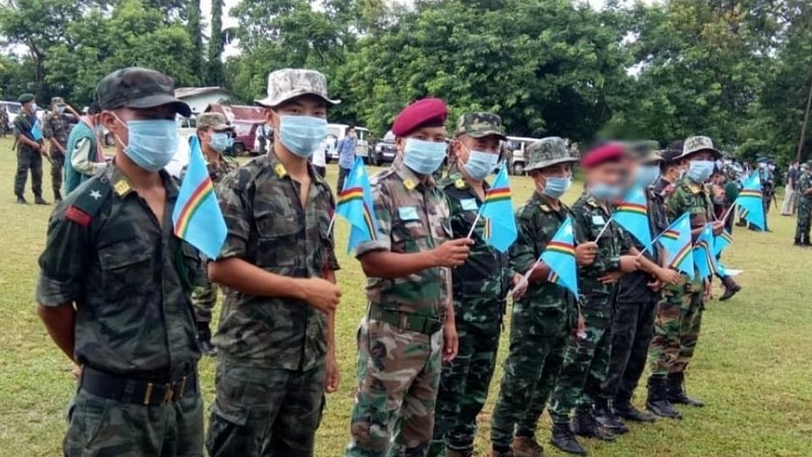 NSCN (IM) members waving "Naga National Flag" in its designated camp at Hebron near Dimapur. Credit: DH File Photo