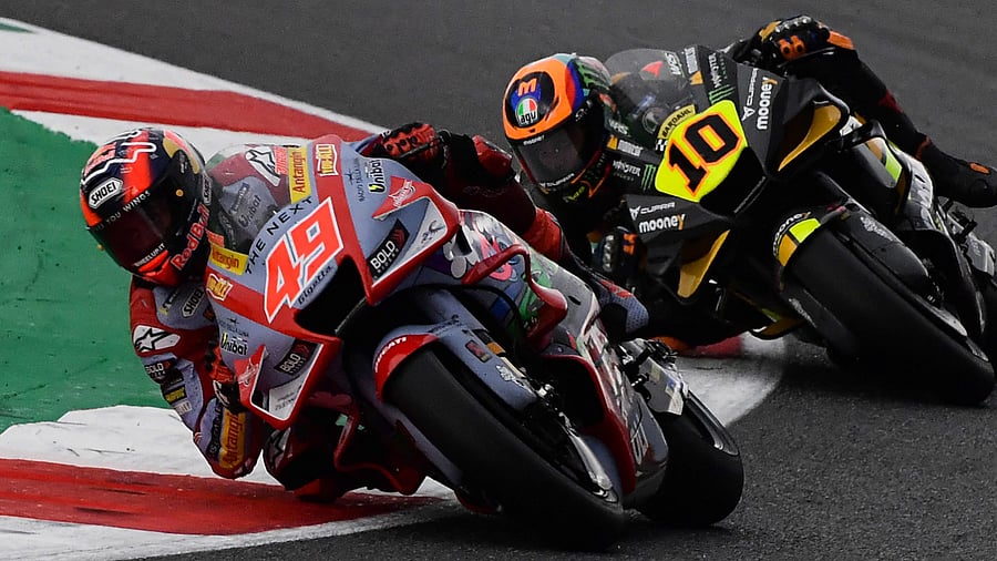Gresini Racing Ducati's Italian rider Fabio Di Giannantonio (L) and Mooney VR46 Racing Ducati's Italian rider Luca Marini. Credit: AFP Photo