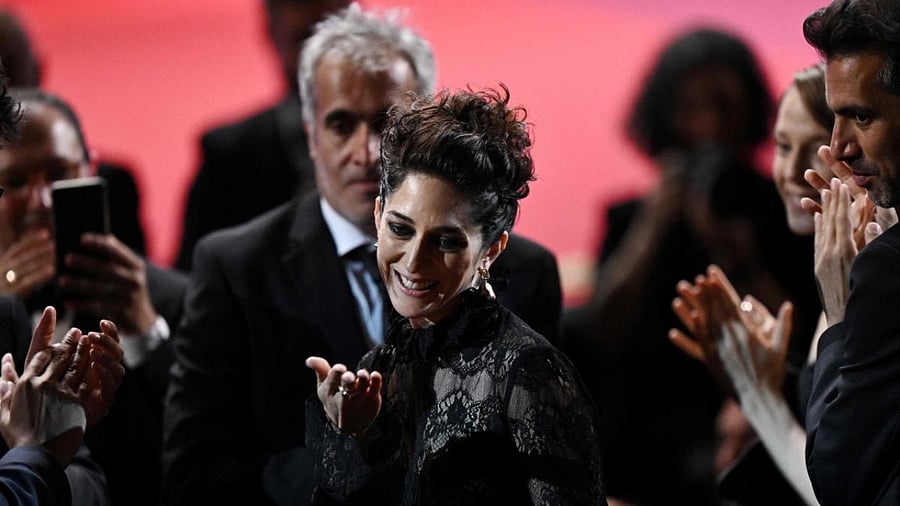 Iranian actress Zar Amir Ebrahimi reacts after she was awarded with the Best Actress Prize for her part in the film "Holy Spider" during the closing ceremony of the 75th edition of the Cannes Film Festival. Credit: AFP Photo