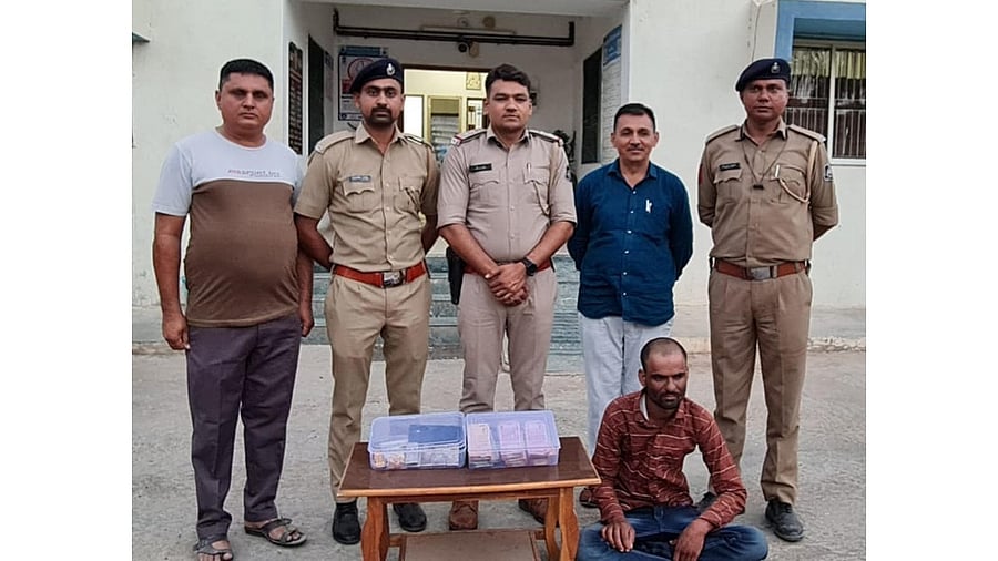 The suspect, Bijaram, in the custody of the Gujarat Police. He was nabbed on Sunday. Credit: Special arrangement