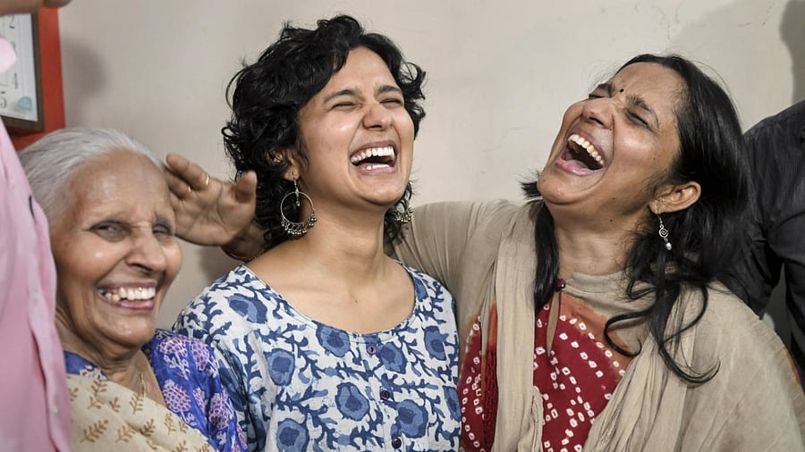 St Stephens alumnus Shruti Sharma, who topped the Civil Services 2021 Exam and secured AIR 1, with her family members at her residence, in New Delhi, Monday, May 30, 2022. Credit: PTI Photo