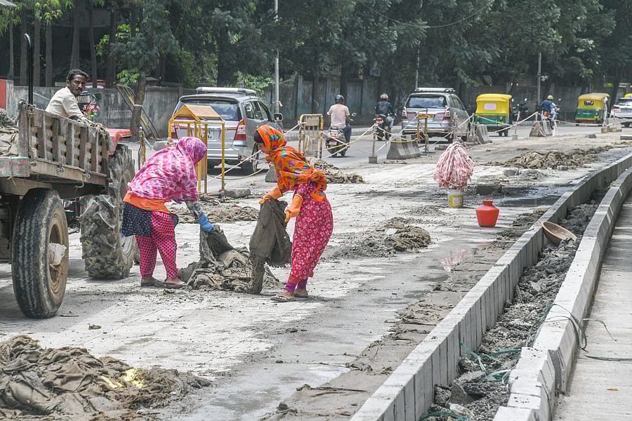 White-topping work at Seshadri Road on Thursday. Credit: DH Photo/S K Dinesh