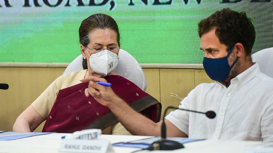 Congress President Sonia Gandhi with party leader Rahul Gandhi. Credit: PTI Photo