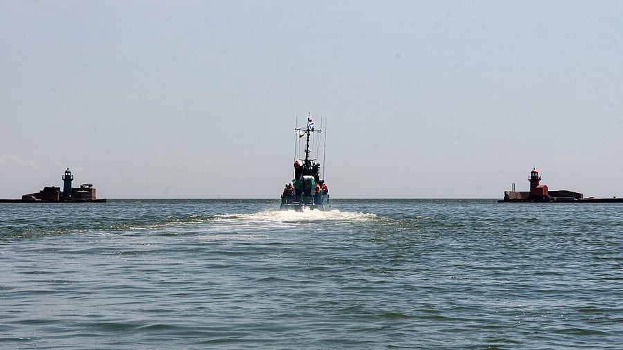 Russian Navy boat of the Black Sea Fleet patrols an aria of the Mariupol Sea Port in Mariupol. Credit: AP Photo