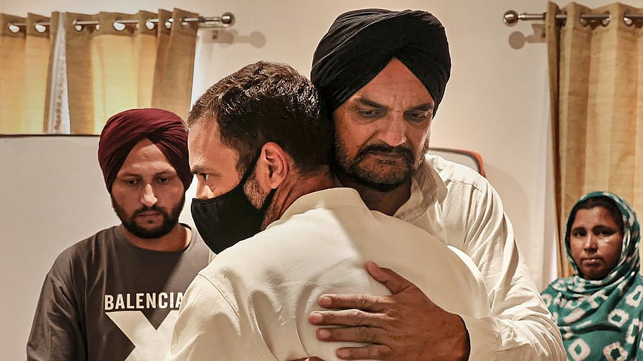 Congress leader Rahul Gandhi meets grieving family of late singer and Congress leader Sidhu Moosewala, in Mansa. Credit: PTI Photo