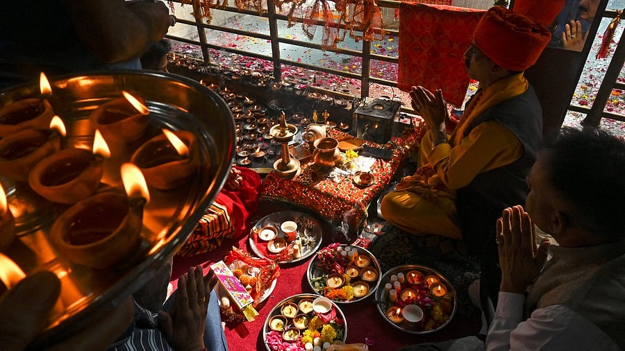 Hindu devotees perform religious rituals during the annual 'Mela Kheer Bhawani' festival at a temple in Tullamulla village on the outskirts of Srinagar. Credit: AFP Photo