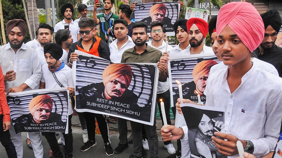 Young men take out a candle march to pay tribute to Punjabi singer Sidhu Moose Wala. Credit: PTI Photo
