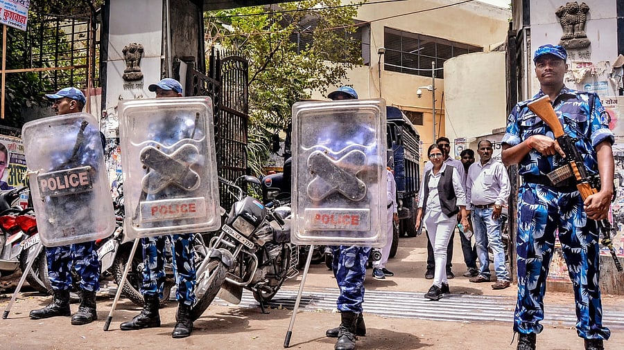 Rapid Action Force personnel stand guard during the production of accused of the Kanpur violence case at a court, in Kanpur. Credit: PTI Photo