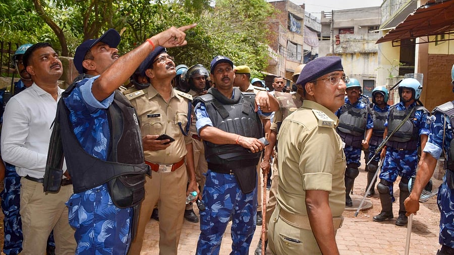 Security personnel conduct a flag march, a day after clashes during protest against now-suspended BJP leaders remark on Prophet Mohammed, in Prayagraj. Credit: PTI Photo