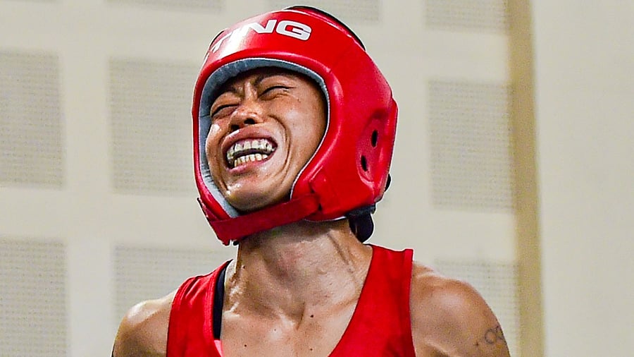 Boxer Mary Kom reacts after getting injured during her match at the Elite Women CWG Trials 2022, at Indira Gandhi stadium, in New Delhi. Credit: PTI Photo